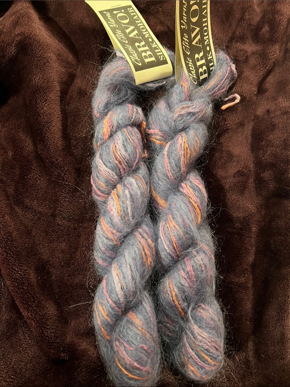 2 yarn hanks 50 grams each approx 48 yards each purply blue with pink